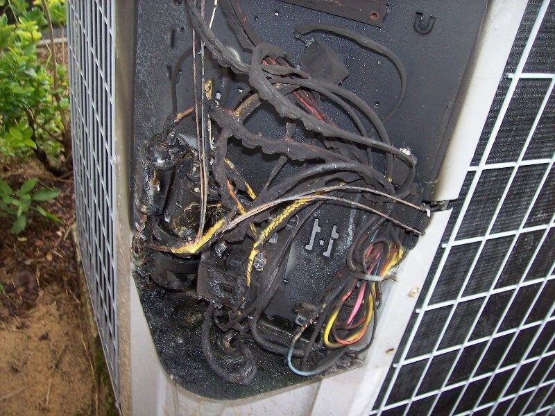 How can I prevent my air conditioner from being damaged during a thunderstorm
