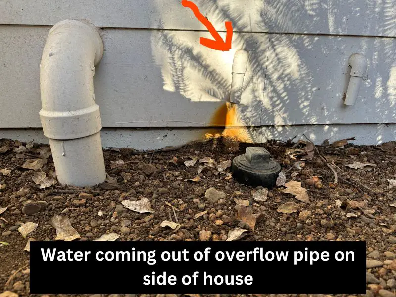 Water coming out of overflow pipe on side of house