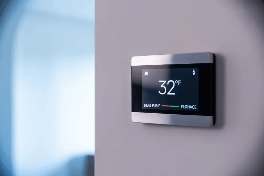 A Homeowner's Guide to HVAC Maintenance and Efficiency 2 a photograph of a modern smart thermostat